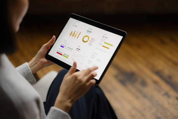 istock Businesswoman Analyzing Market Data on Tablet in Modern Office 2188611237