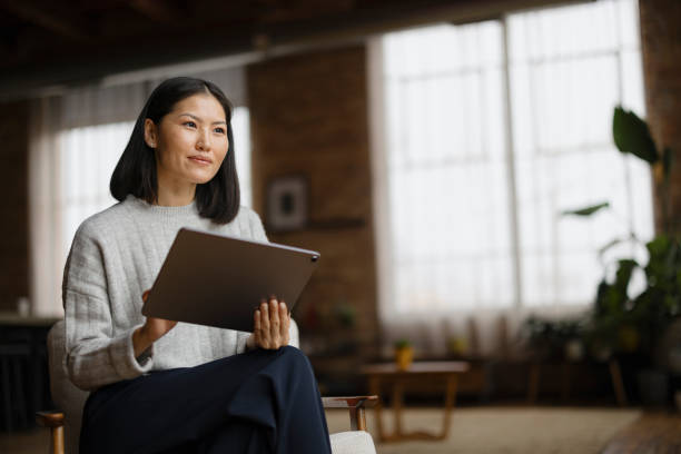 istock Businesswoman Working on Tablet in Modern Office Setting 2188611246