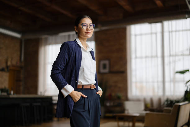 istock Confident Businesswoman Standing in Modern Loft Office Environment 2188611267