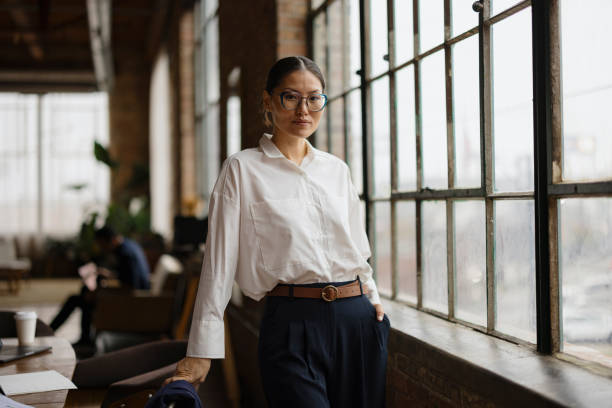 istock Confident Woman In Modern Office Setting Near Large Windows 2188611285