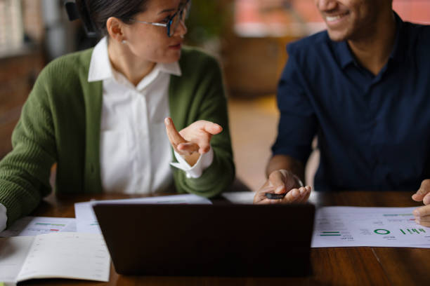 istock Collaborative Coworkers Analyzing Business Data in Casual Office Environment 2188611318