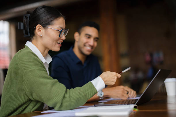 istock Colleagues Collaborating in a Modern Office Using a Laptop and Tablet 2188611323