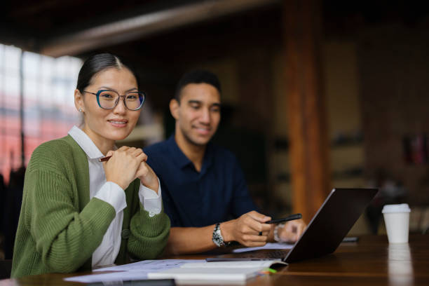 istock Smart Casual Business Colleagues Collaborating in Modern Office Environment 2188611331