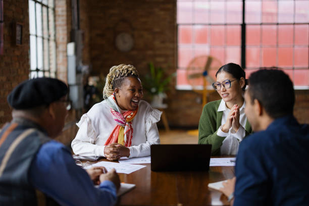 istock Diverse Group of Colleagues Collaborating in Modern Office Setting 2188611357