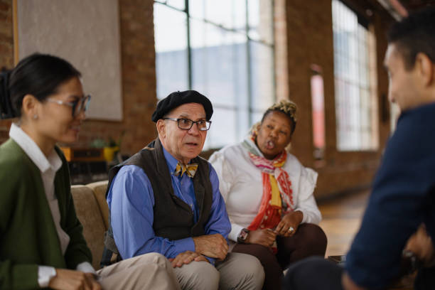 istock Diverse Group of Colleagues Engaged in Office Discussion Meeting 2188611379