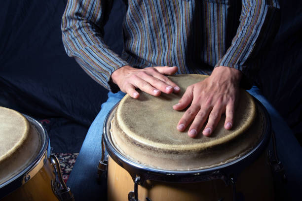 istock Close-Up of Hands Playing Conga Drums 2188612678