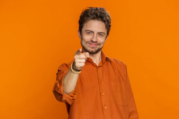 istock Happy Caucasian smiling man pointing finger to camera making winner choice showing direction, select 2188615094