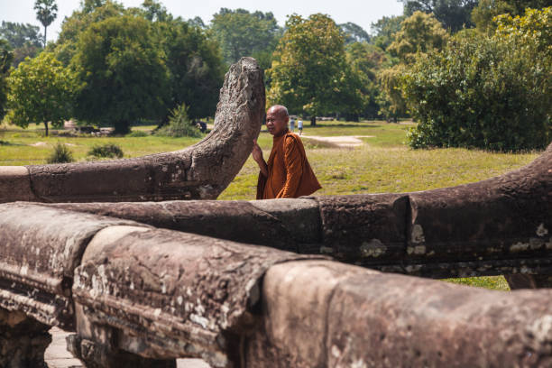 Siam Reap, Cambodia – December 13, 2017: A vertical shot of Buddhist Monks at Ankor Wat Temples