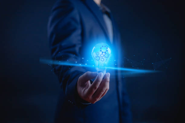 istock Idea innovate and concept. Hand holding a light bulb that shine glitter, creative thinking concept success, management and digital transformation, data search, thinking, bulb, technology 2188622865