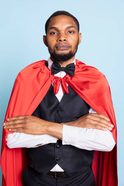 istock African american doorman posing in a superhero red mantle in studio 2188626239