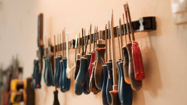 istock Close up of various woodworking tools on rack, panning shot 2188627430