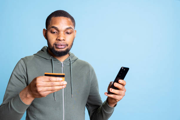 istock Happy excited african american man making a purchase online 2188629629