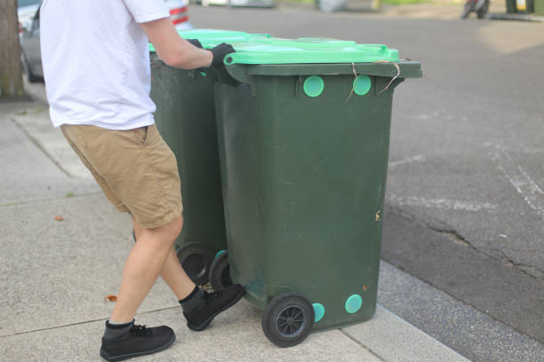 istock Person putting out bins ready for collection 2188634374