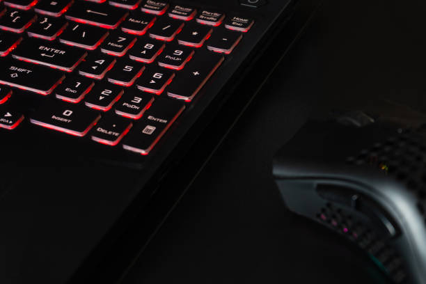 istock A powerful laptop for gaming and a high-tech mouse on a modern desk 2188635000