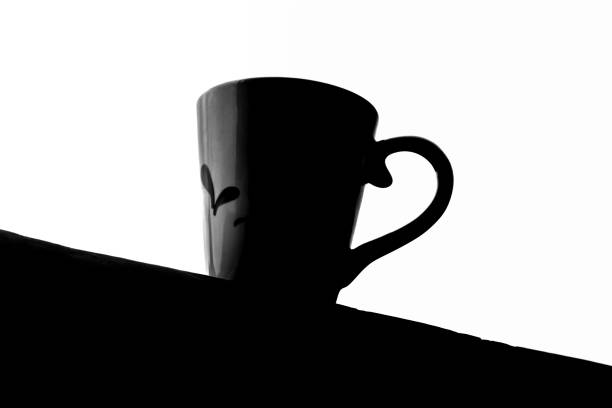 Silhouette of a coffee or tea cup against a sky background