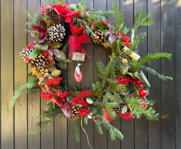 istock Traditional Christmas Wreath made from pine branches, pine cones, red berries 2188644794