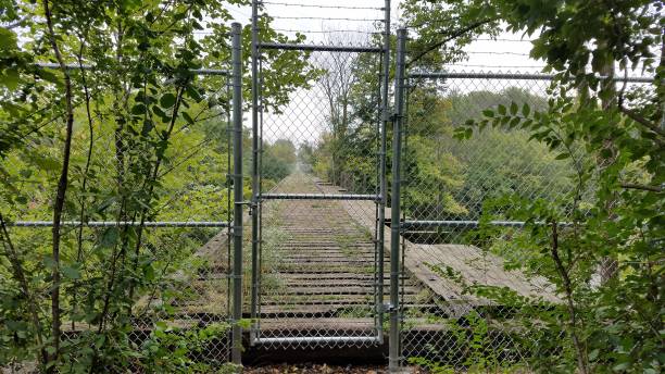 istock Abandoned Train Trestle in Burlington, Wisconsin with Chain Link Fence 2188645425