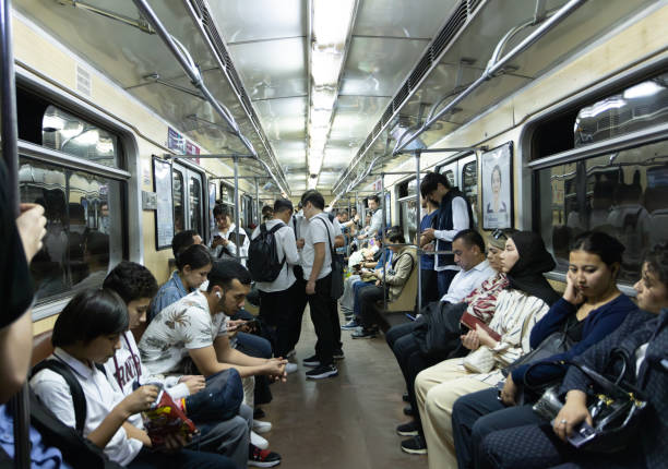 Tashkent, Uzbekistan, October 4 2024: crowd of commuters sit on the seats in box car. Tashkent metro built in the former USSR, opening in 1977, and the first metro in Central Asia