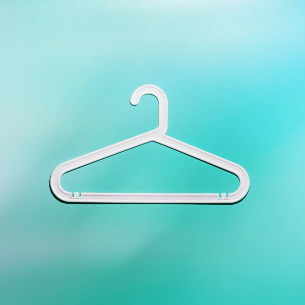 istock Top view minimal style photo of white plastic hanger with hooks on white blue background. Flat lay with Clothes rack for hanging garments. Minimal trend image, lifestyle or interior design content 2188648678