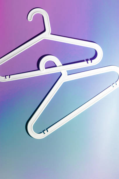 istock Top view White Plastic hanger, minimal style layout on purple blue neon gradient background, Clothes rack for organizing clothes in closets or retail stores, fashion, organization concept, copyspace 2188648680