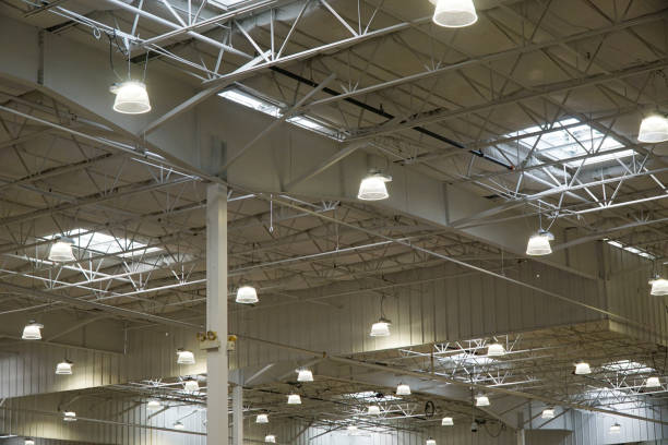 istock interior view of warehouse roof with bright light 2188649446