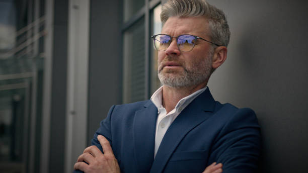 istock Pensive Caucasian middle-aged old man thinking thoughtful serious senior businessman think looking away pondering idea mature retired business male employer 60s entrepreneur investor in city outdoors 2188650662