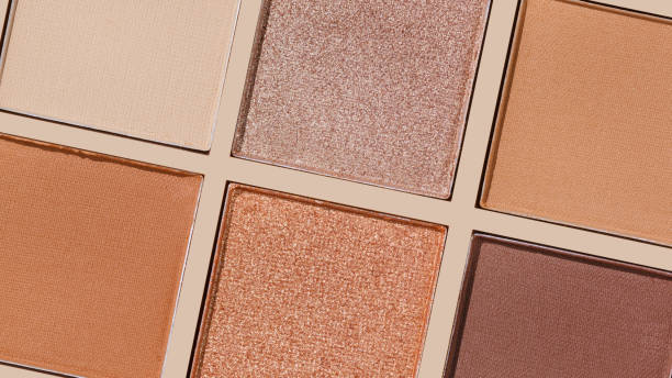 istock Cosmetics close up texture pattern, makeup palette vivid neutral color eye shadow, eye powder swatches, banner. Cosmetic, beauty products, aesthetic minimal beauty photo, colorful eyeshade, top view 2188652087