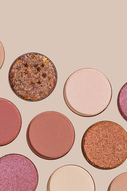 istock Cosmetics texture pattern, Warm vivid colored eye shadow makeup palette, round eye powder swatches. Female cosmetic and beauty products, aesthetic minimal beauty photo, colorful eyeshade, top view 2188652092