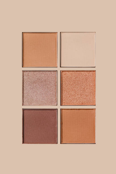 istock Neutral Eyeshadow Palette with Matte and Shimmer texture, natural colored shades on beige. Set of eyeshadow refills, Top view of six Swatches Eyeshadow makeup for cosmetic, makeup, beauty concept 2188652093