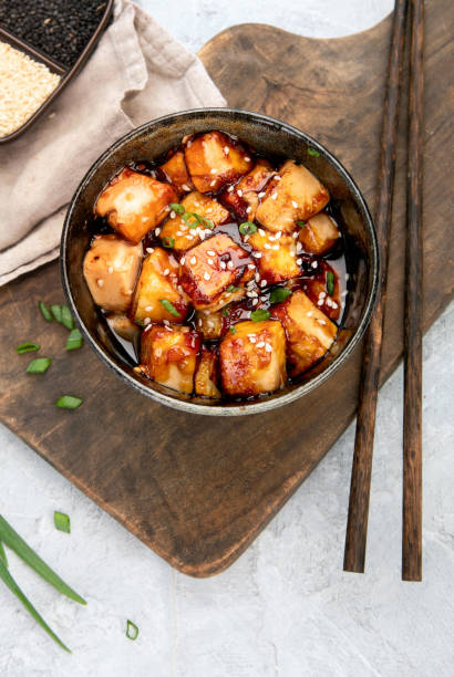 istock Traditional homemade fried tofu with sesame on light gray background. 2188652600