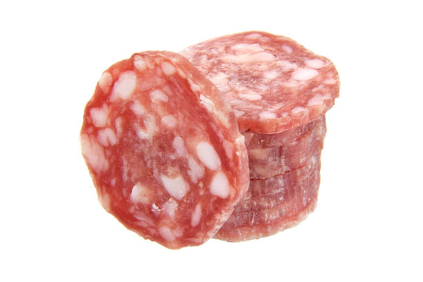 Pork salami sausage slice in stack closed up isolated on white