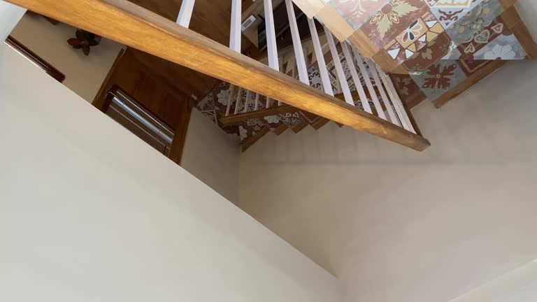 Showing the stairs in a house with a simple, aesthetic and elegant theme. Unique ceramic floor tiles.
