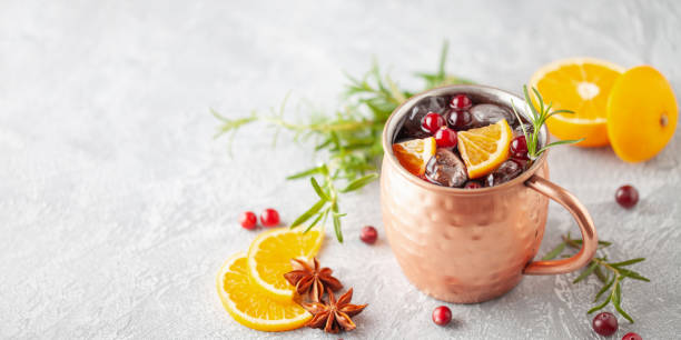 istock Cranberry Orange Moscow mule, holiday drink in a copper mug. Grey stone background. 2188655657