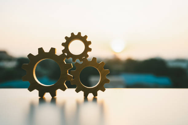 istock Gears from at blue urban and sunlight background. concept of a teamwork cooperation idea. 2188655699