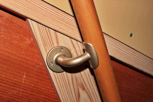 istock Newly constructed wooden building Stair handrail installation work 2188662013