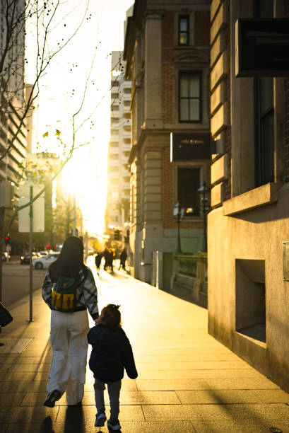 istock Mother And Son Walking Across Street 2188663561