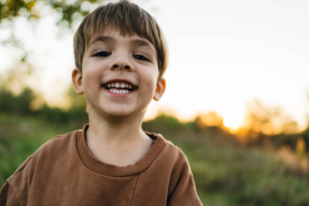 istock Smiling young boy outdoors 2188665563