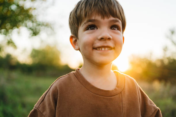 Smiling young boy outdoors