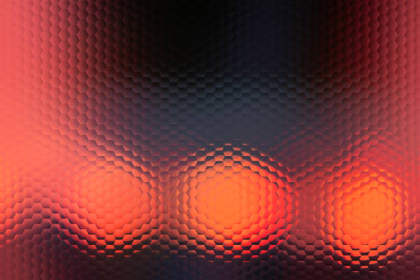 A blurry image of three orange circles with a red background. The circles are all different sizes and are overlapping each other. The image has a dreamy, surreal feel to it