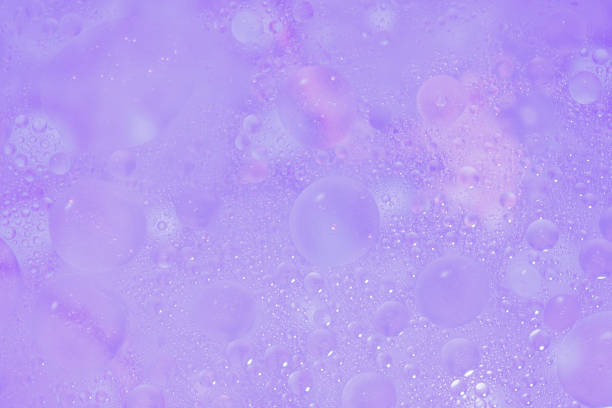 Floating colorful oil bubbles in water offer an abstract visual feast of texture and light.