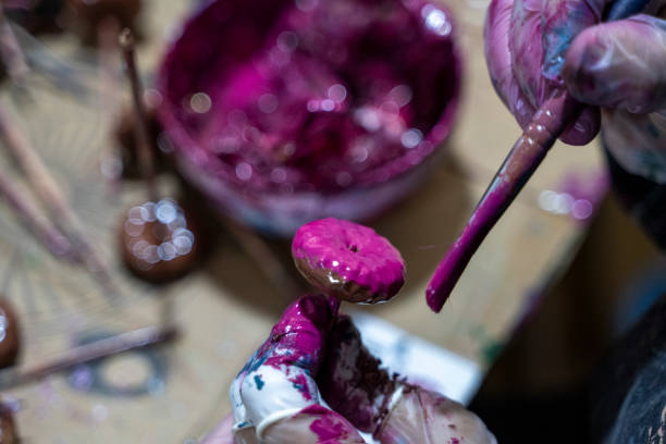 istock A craftsman is painting a craft with paint 2188670023