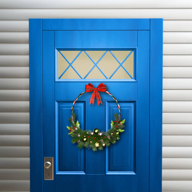 istock Christmas wreath hanging on residential door. 3D render. 2188676597