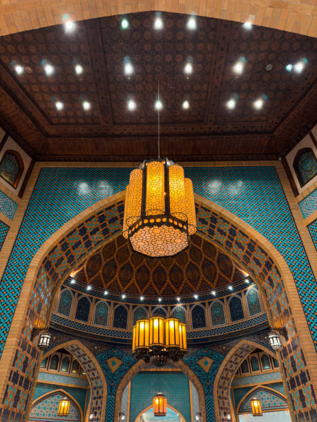 istock Islamic mosque ceiling with painted murals and geometric patterns, large chandelier in center of dome, Islamic Architecture background wallpaper 2188679110