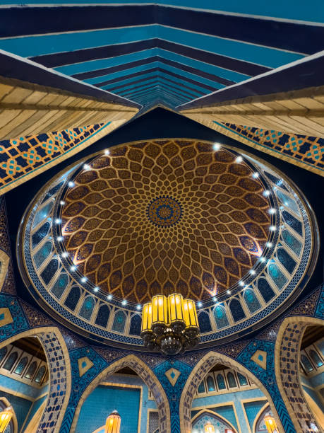 istock Grand Iranian Mosque interior with Dome and Islamic arches, intricate design, hand painted details, murals, geometric design, luxury chandelier, Islamic interior background 2188679638