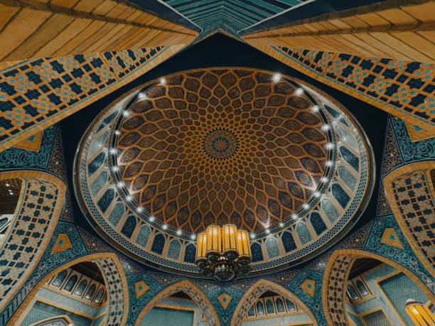 istock Historic Moroccan Mosque interior with Dome and Islamic arches, intricate design, hand painted details, murals, geometric design, luxury chandelier, Islamic interior background 2188679710