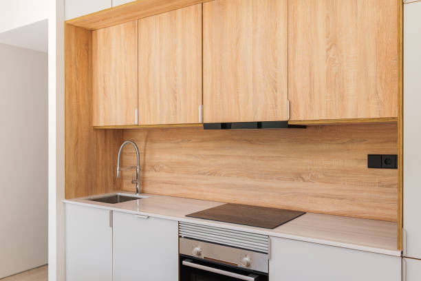 istock Modern kitchen interior with wooden cabinets, oven and stove with extractor 2188680158