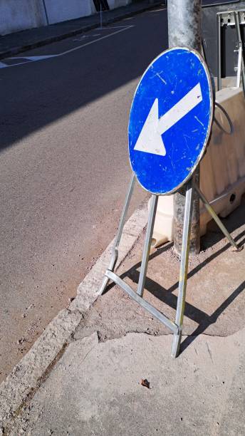 istock Roadworks with sign on sidewalk location Italy 2188680398