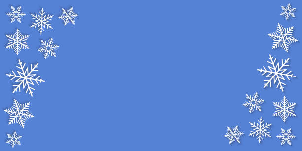 istock White snowflakes on the sides of a blue background as decorative frame and border for copy space 2188680970