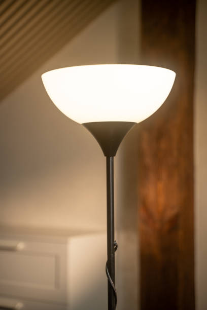 istock Lamp lighting up in cozy room during evening ambience 2188688614