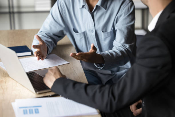 istock Cropped view two traders analysts discussing market trends 2188688764